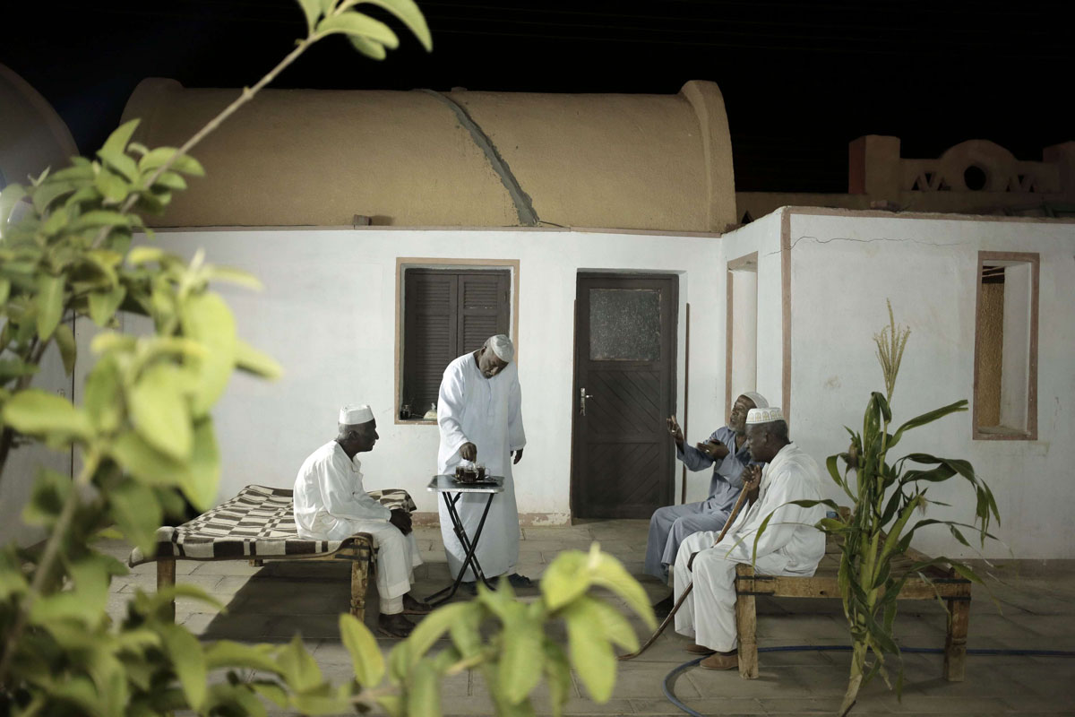 Nubian men talk at a home in Wadi Karkar in the desert west of Lake Nasser
