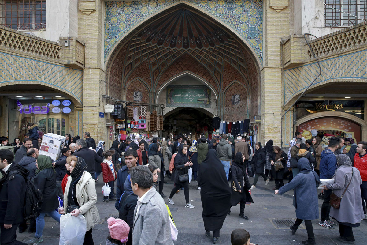 People walk around the Grand Bazaar in Tehran
