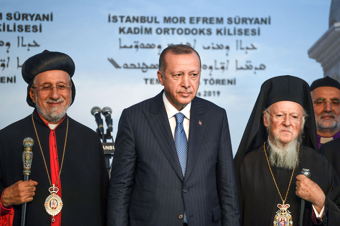 Turkish President Recep Tayyip Erdogan (C), Syriac (Assyrian) Orthodox Patriarch Yusuf Cetin (L) and Ecumenical Patriarch of Constantinople Bartholomew I (R)