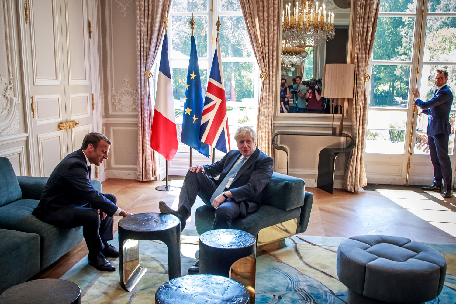 French President Emmanuel Macron and British Prime Minister Boris Johnson speak during a meeting at the Elysee Palace