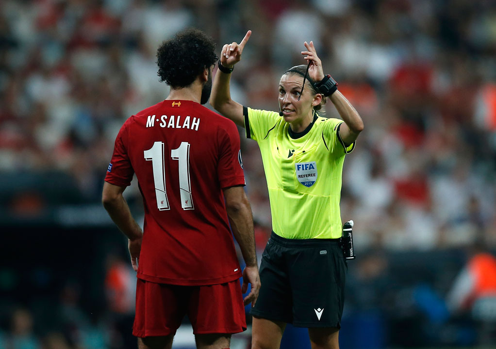 Referee Stephanie Frappart gestures as she speaks to Liverpool's Mohamed Salah during the UEFA Super Cup final in Istanbul