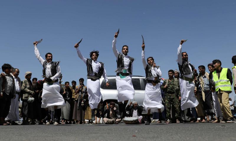 Huthi supporters perform the traditional Baraa dance during a ceremony held to collect supplies for Huthi fighters in Sanaa