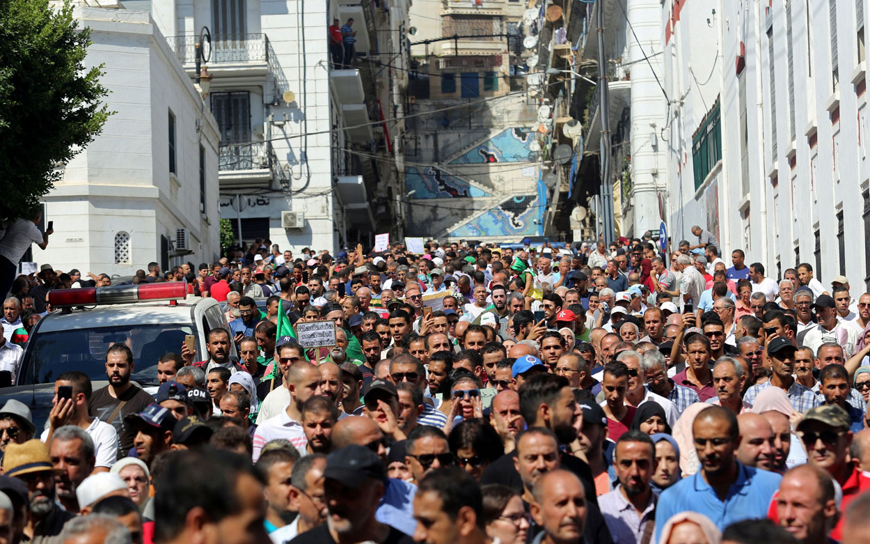 Demonstrators gather during a protest demanding social,  economic and political reforms in Algiers