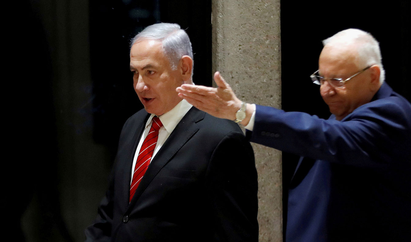 Israeli President Reuven Rivlin and Prime Minister Benjamin Netanyahu arrive at a nomination ceremony at the President's residency