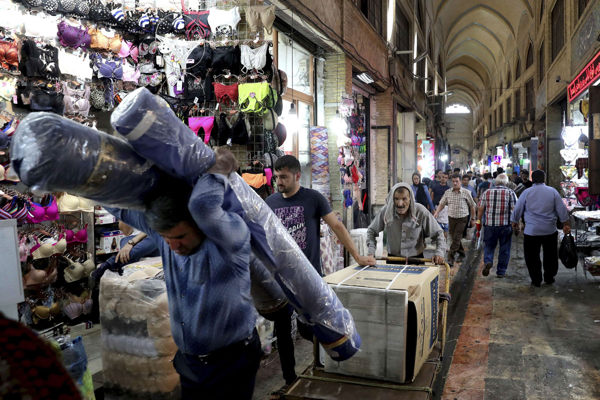 People conduct their business at the old main bazaar in Tehran, Iran