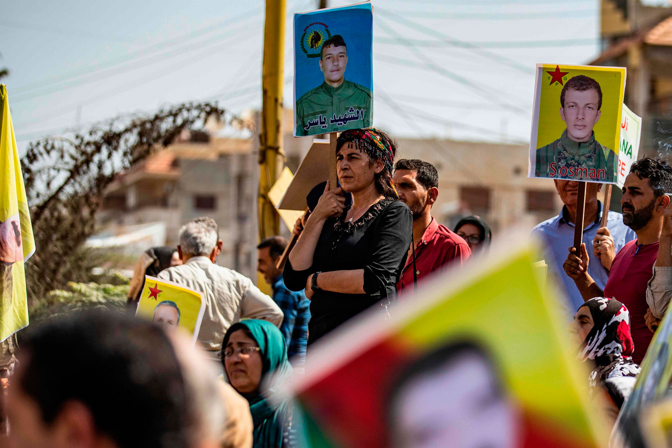 Syrian Kurds demonstrate in front of the United Nations headquarters in the Kurdish-majority city of Qamishli