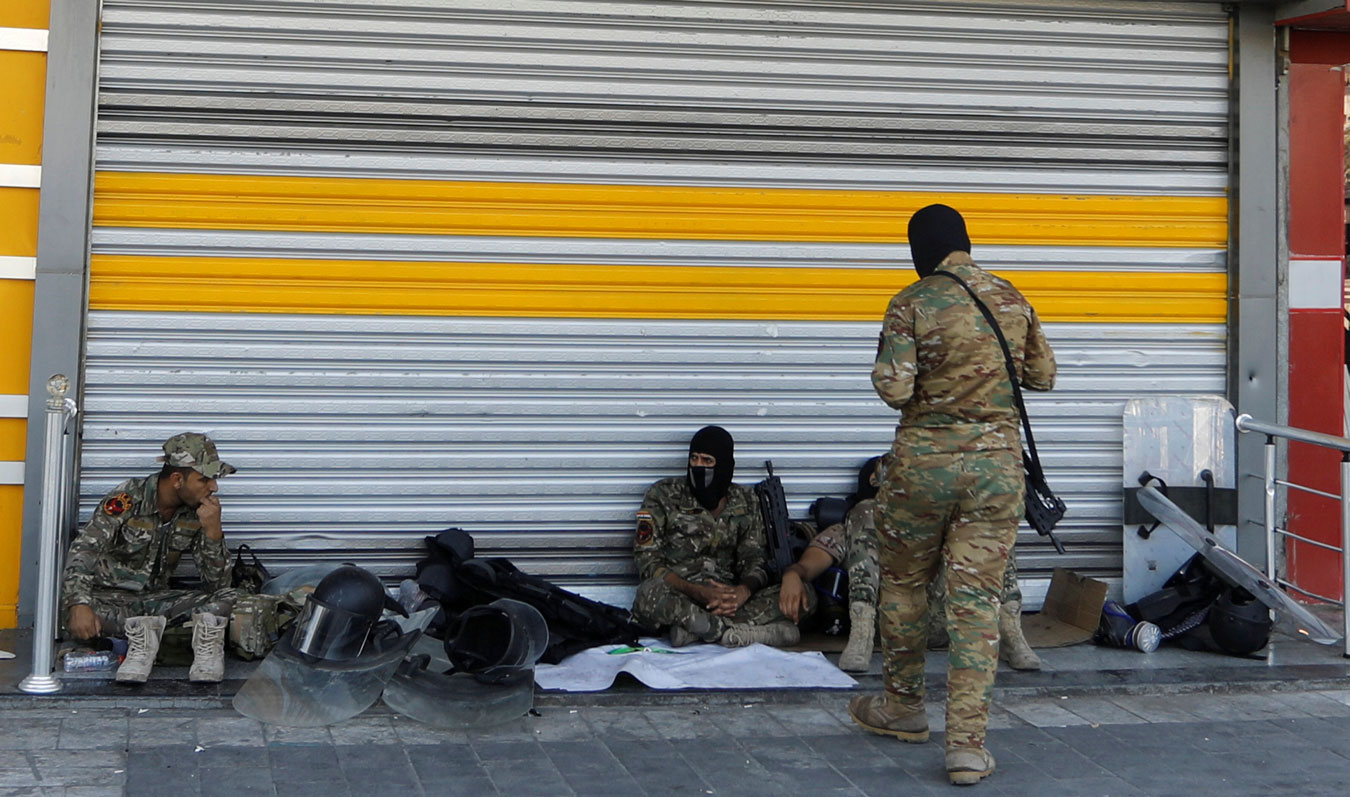 Iraqi security forces pictured in Tahrir square after the lifting of the curfew