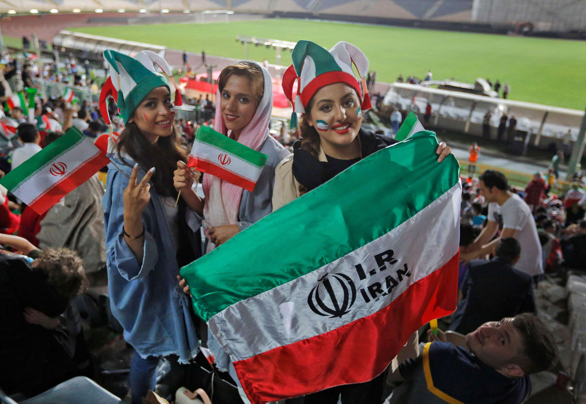 Iranian women watch the World Cup Group B soccer match between Portugal and Iran at Azadi stadium in Tehran