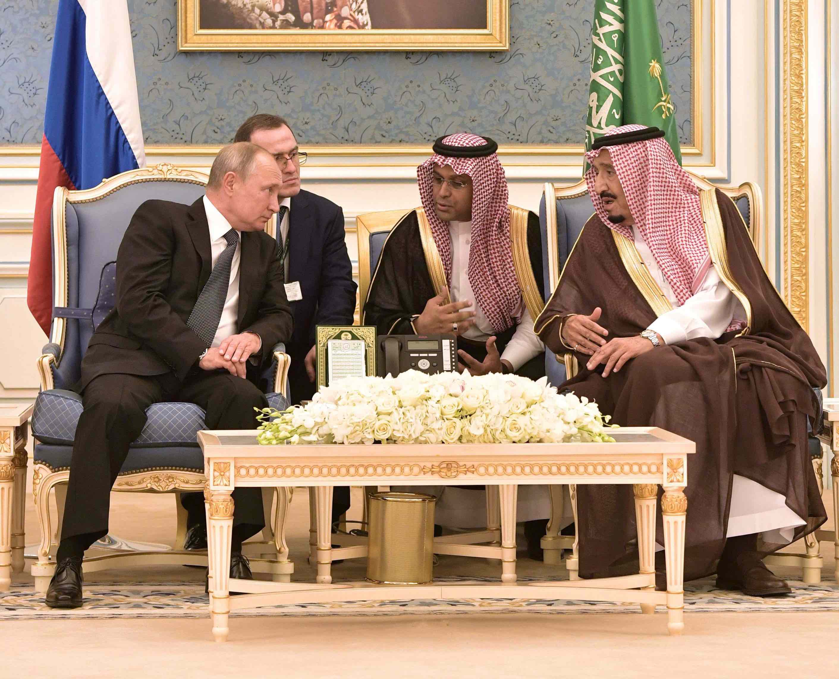 Russian President Vladimir Putin (L) and Saudi King Salman bin Abdulaziz Al Saud attend a meeting in Riyadh