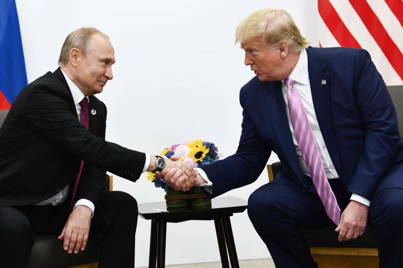 Photo taken on June 28, 2019 shows US President Donald Trump (R) attends a meeting with Russia's President Vladimir Putin during the G20 summit in Osaka.