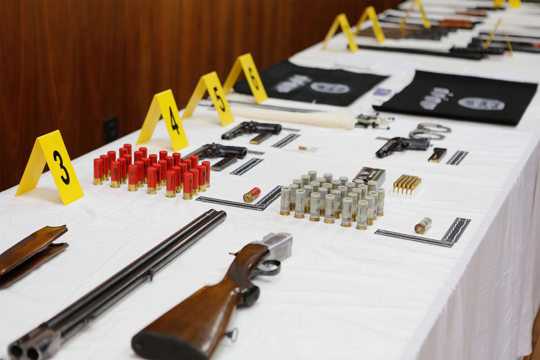 Weapons and ammunition seized following the dismantling of a terrorist cell are displayed at the BCIJ headquarters