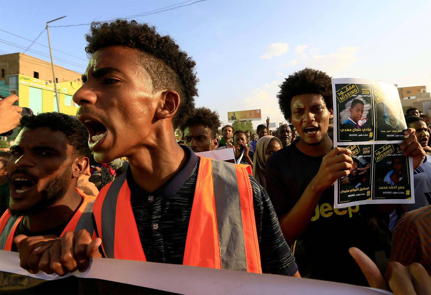 Sudanese protesters chant slogans during a rally calling for the former ruling party to be dissolved and for ex-officials to be put on trial in Khartoum