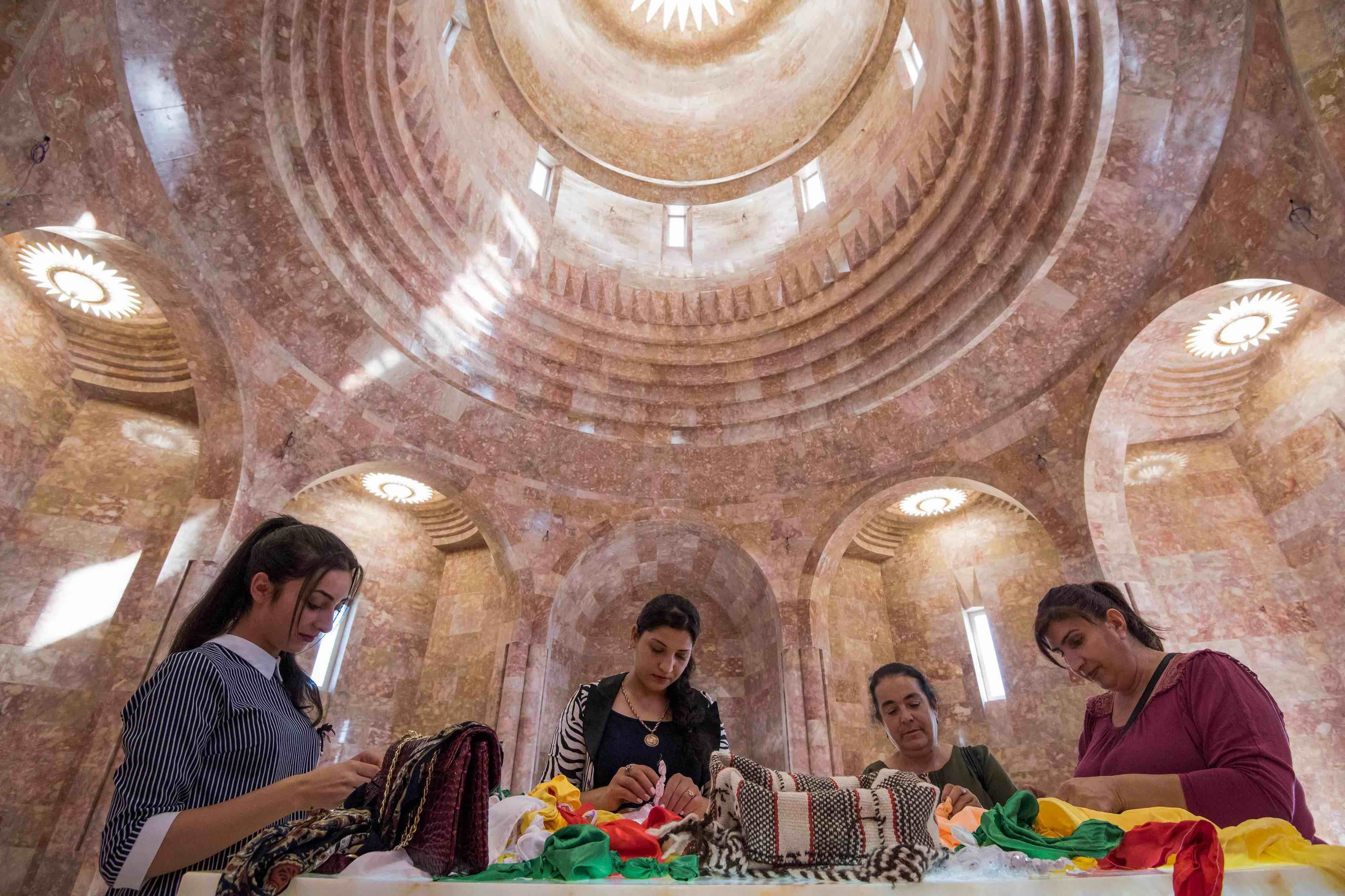 The temple's seven domes topped with sun symbols represent the seven angels revered by the Yazidis