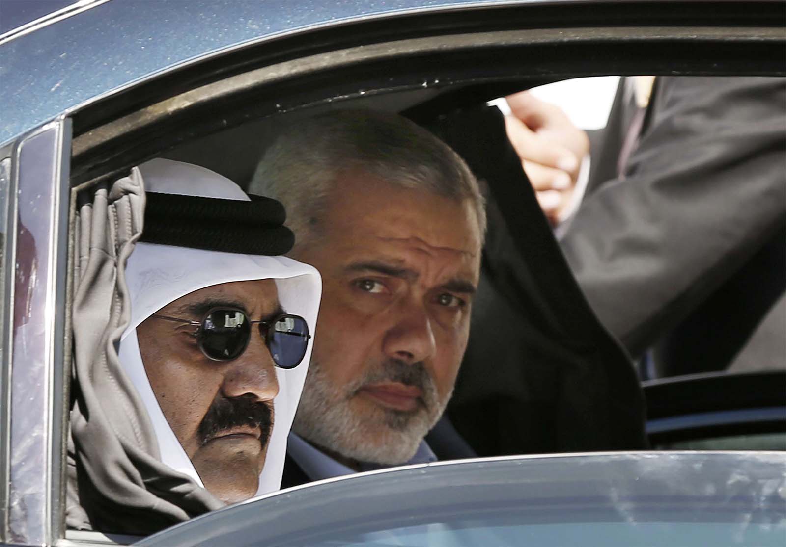 Former Emir of Qatar Sheikh Hamad bin Khalifa al-Thani and Gaza's Hamas prime minister Ismail Haniyeh