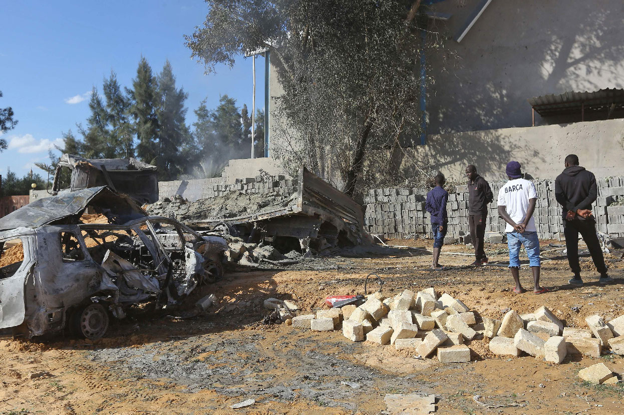 Aftermath of a reported air strike on a factory south of the Libyan capital Tripoli