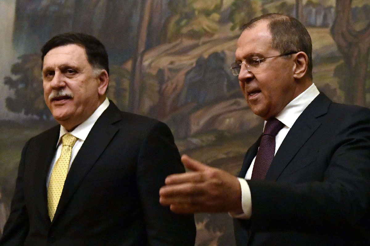 2017 file picture shows Russian Foreign Minister Sergei Lavrov (R) and head of the Tripoli-based Presidential Council Fayez al-Sarraj