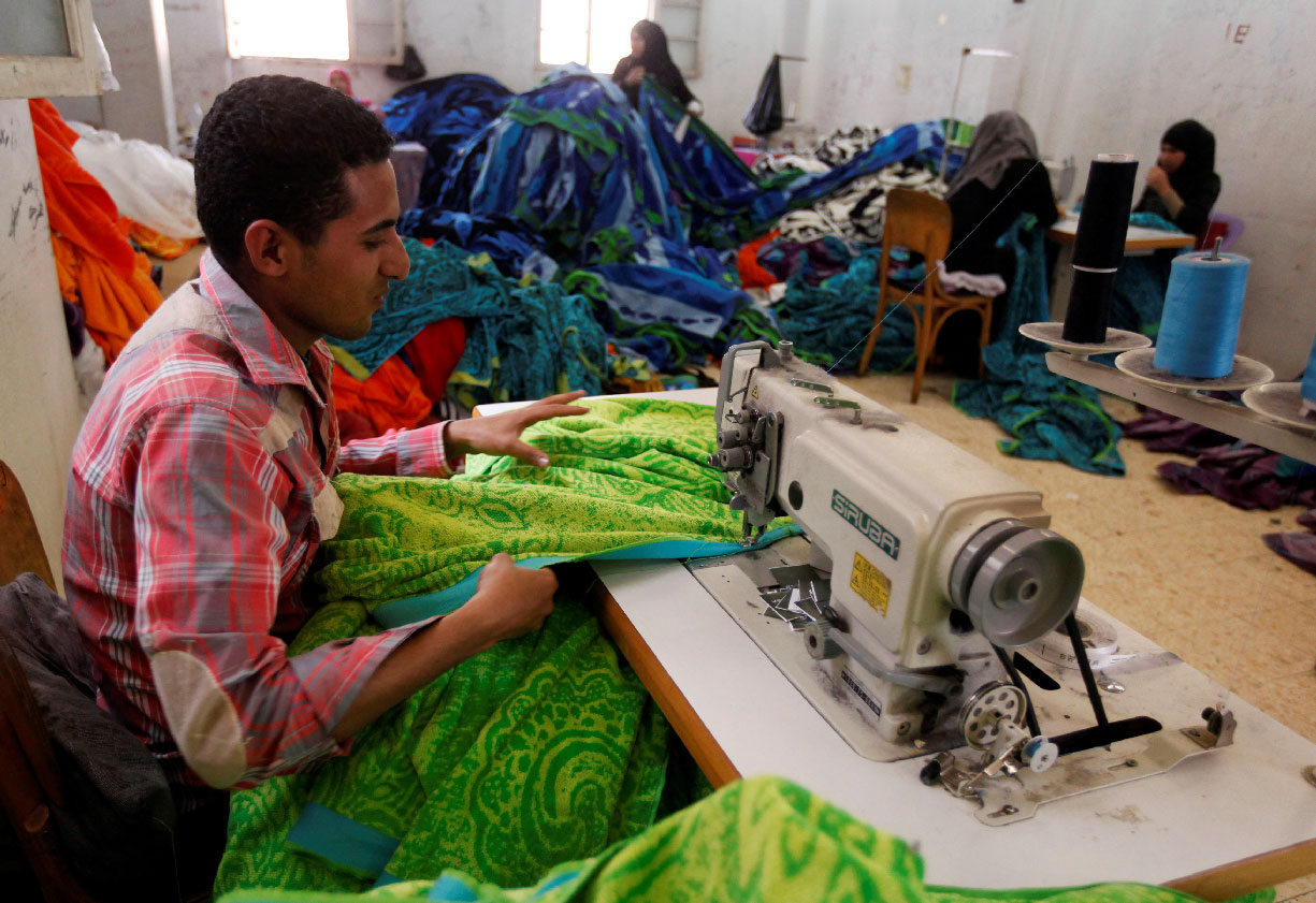 A labourer works at a textile mill in Al-Mahalla al-Kubra, Egypt