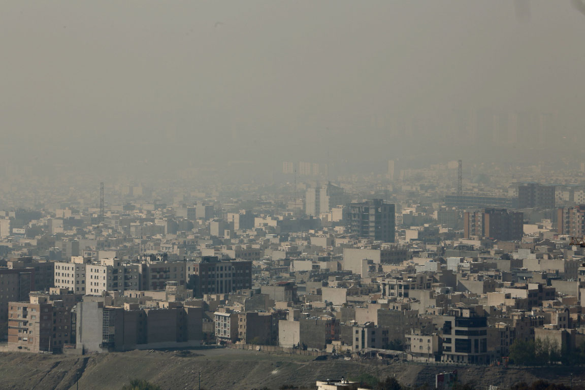 A blanket of brown-white smog covers Tehran due to heavy pollution