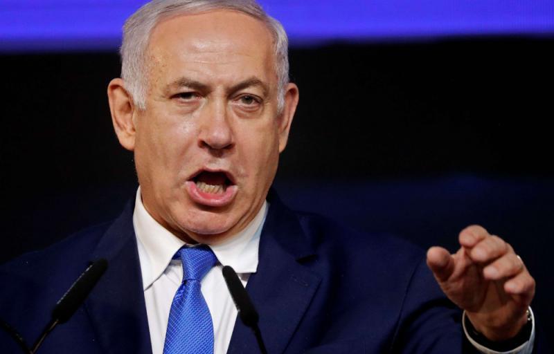 Israeli Prime Minister Benjamin Netanyahu addresses supporters at his Likud Party headquarters in Tel Aviv