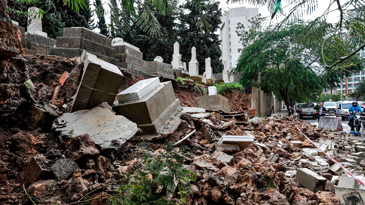 Graves damaged during bad weather in a winter storm at the Jewish cemetery in the Lebanese capital Beirut