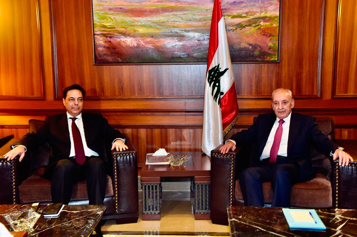 Parliament Speaker Nabih Berri, right, meets with newly-assigned Lebanese Prime Minister, Hassan Diab