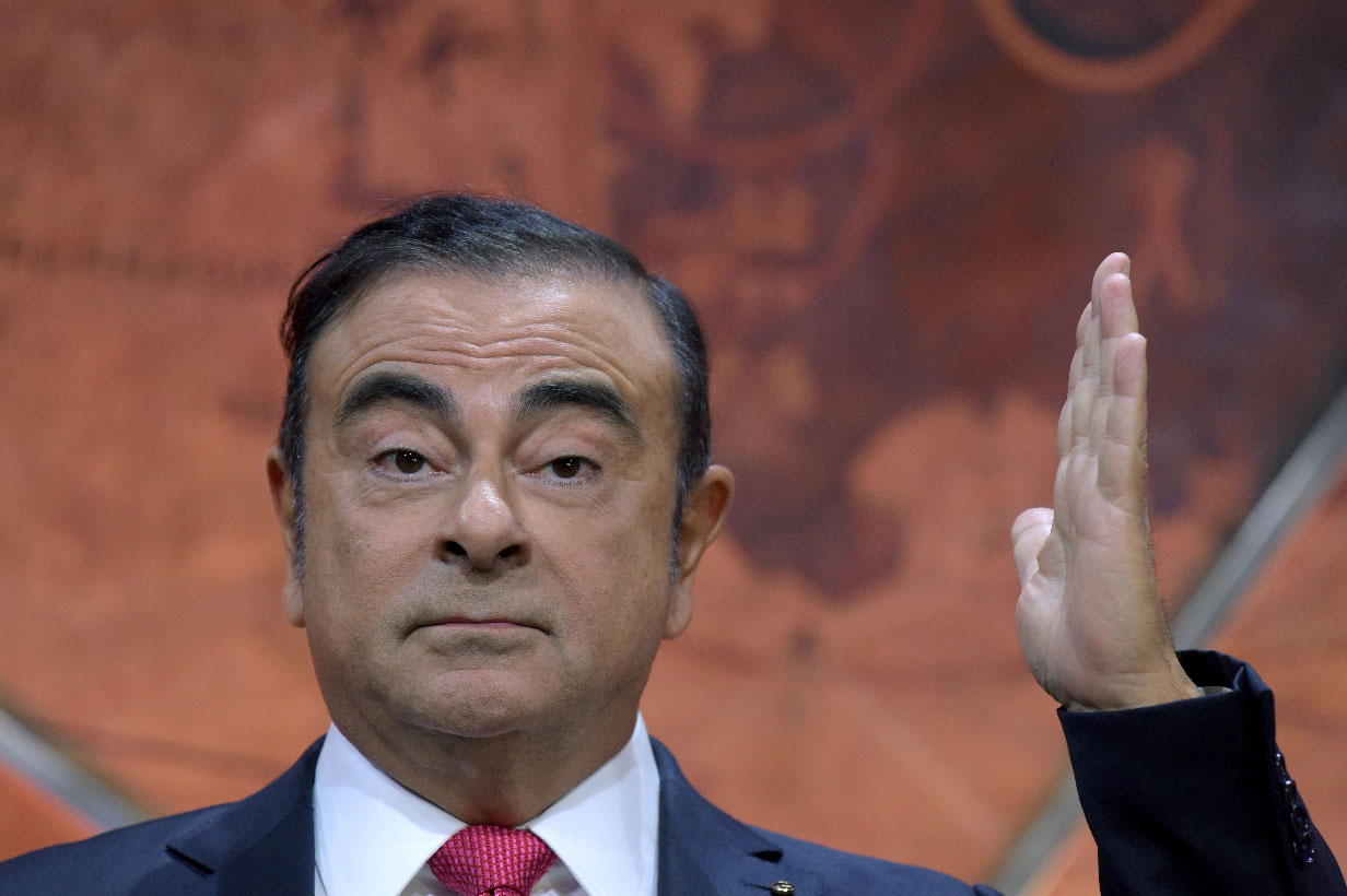 Carlos Ghosn gestures as he addresses a press conference in Paris on September 15, 2017