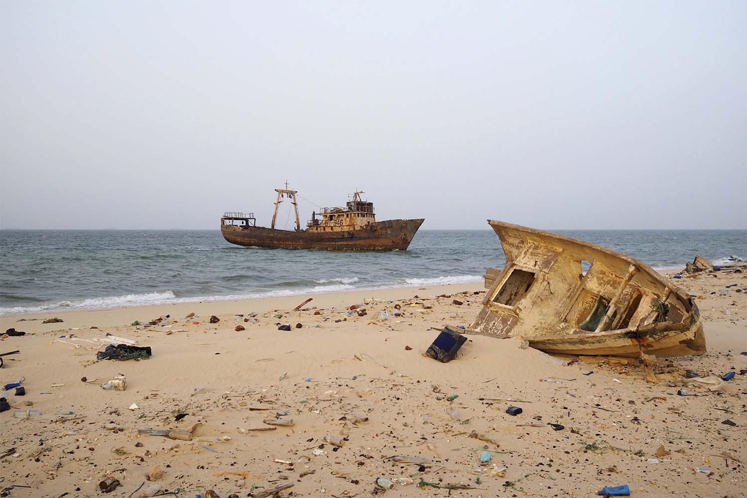 A decaying boat is seen docked off the port of Nouadhibou 