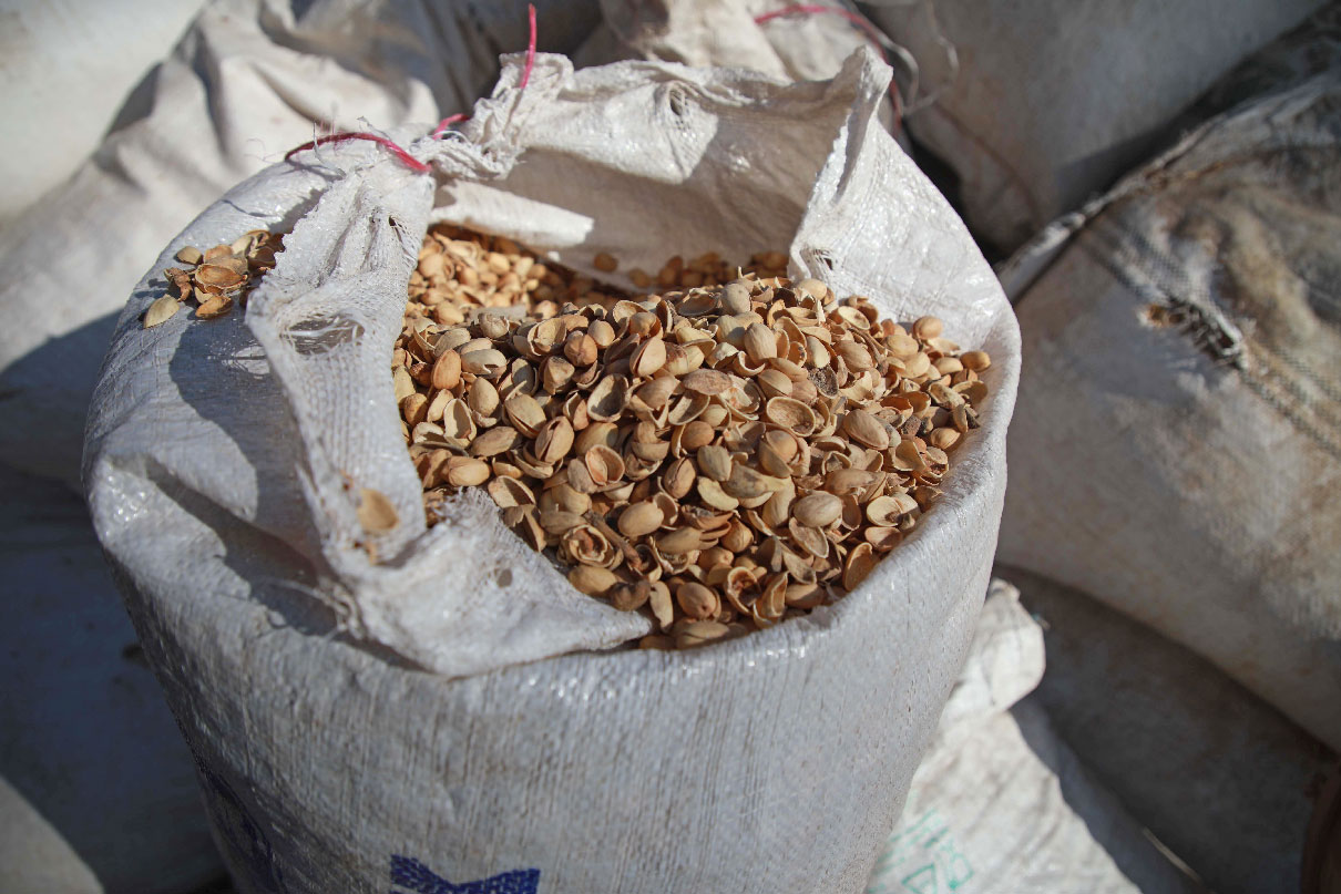 A sack of pistachio shells is seen at a workshop specialised in building pistachio-powered heaters in al-Dana town, Idlib
