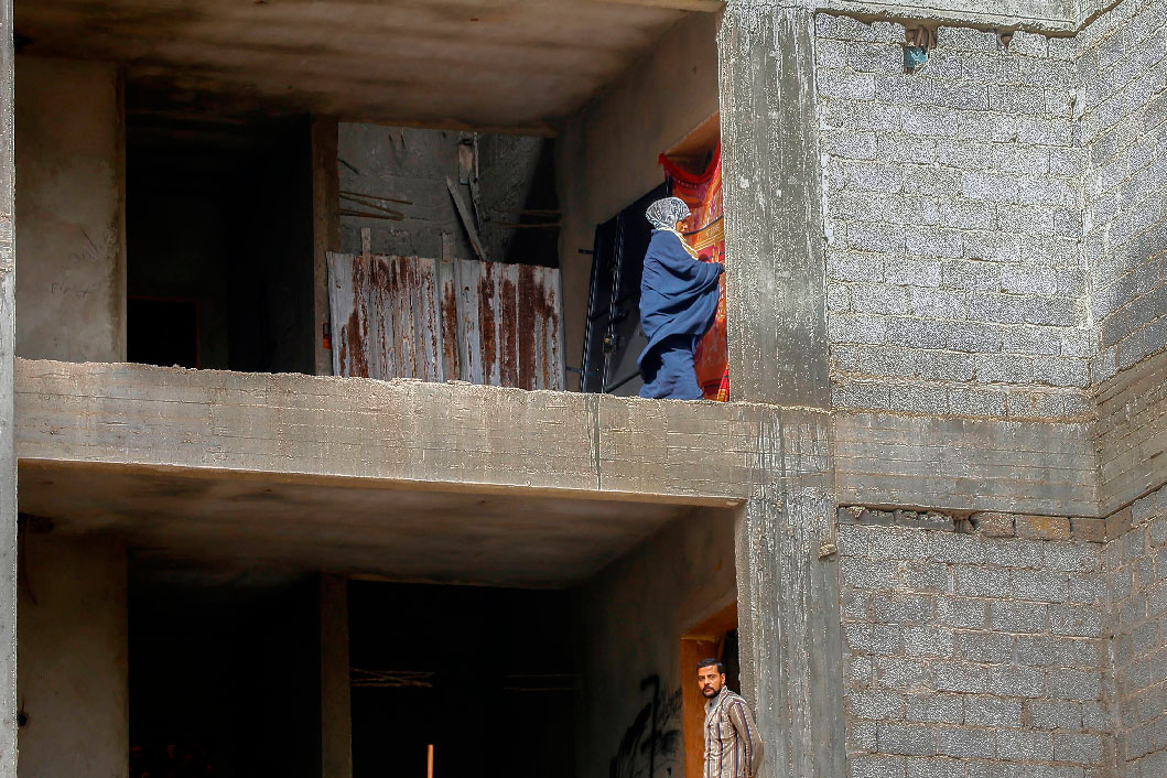 Displaced Libyans are pictured in an unfinished building in the Libyan capital Tripoli