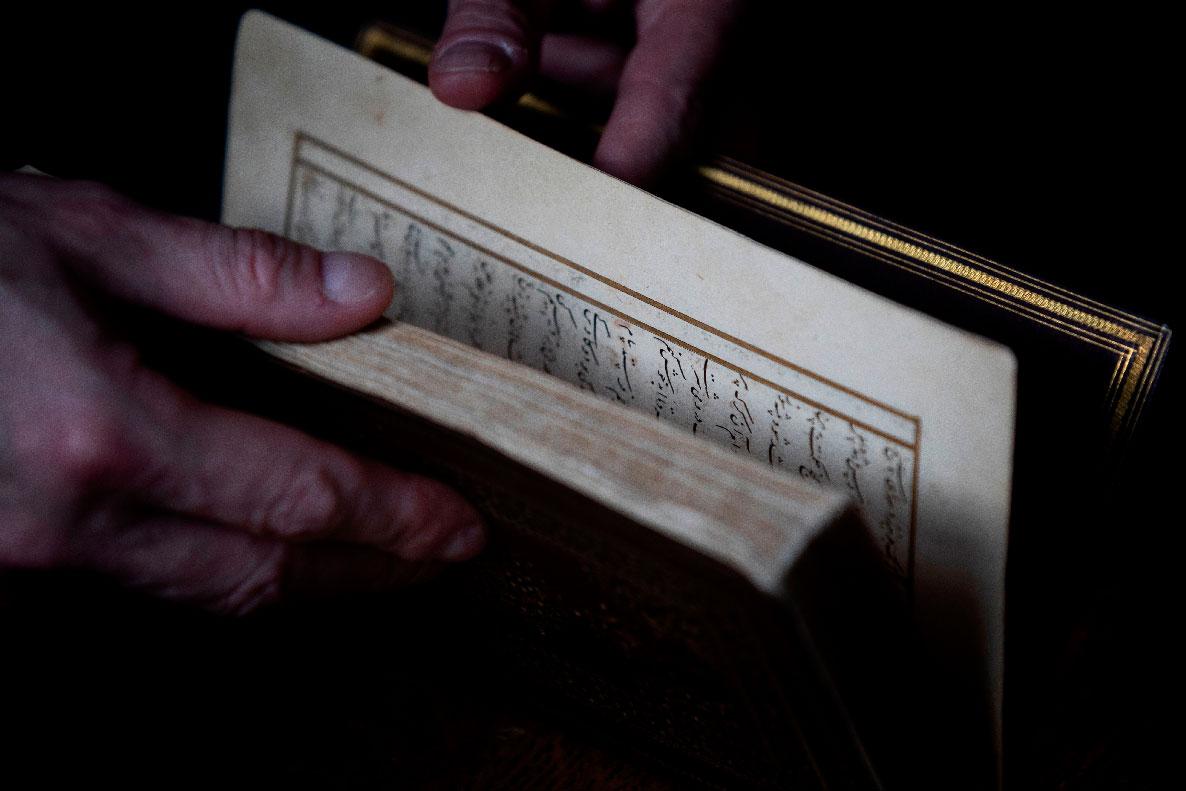 Dutch art crime investigator Arthur Brand holds a rare 15th-century copy of the 'Divan of Hafez'