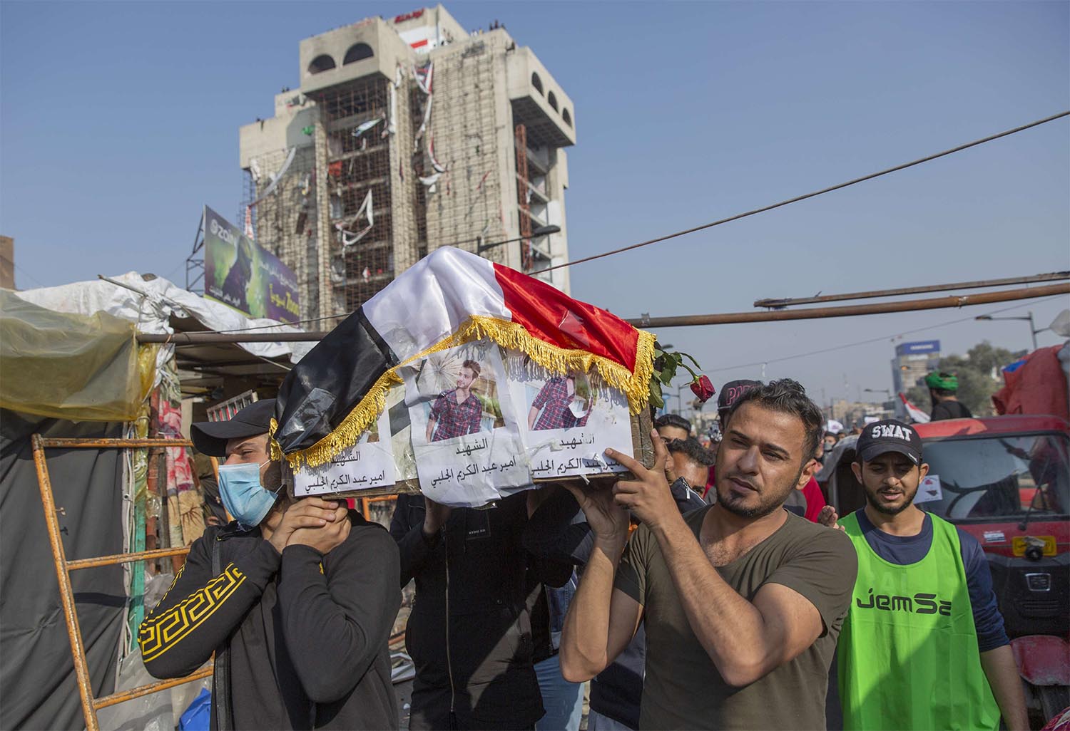 Mourners carry the body of a fellow protester 