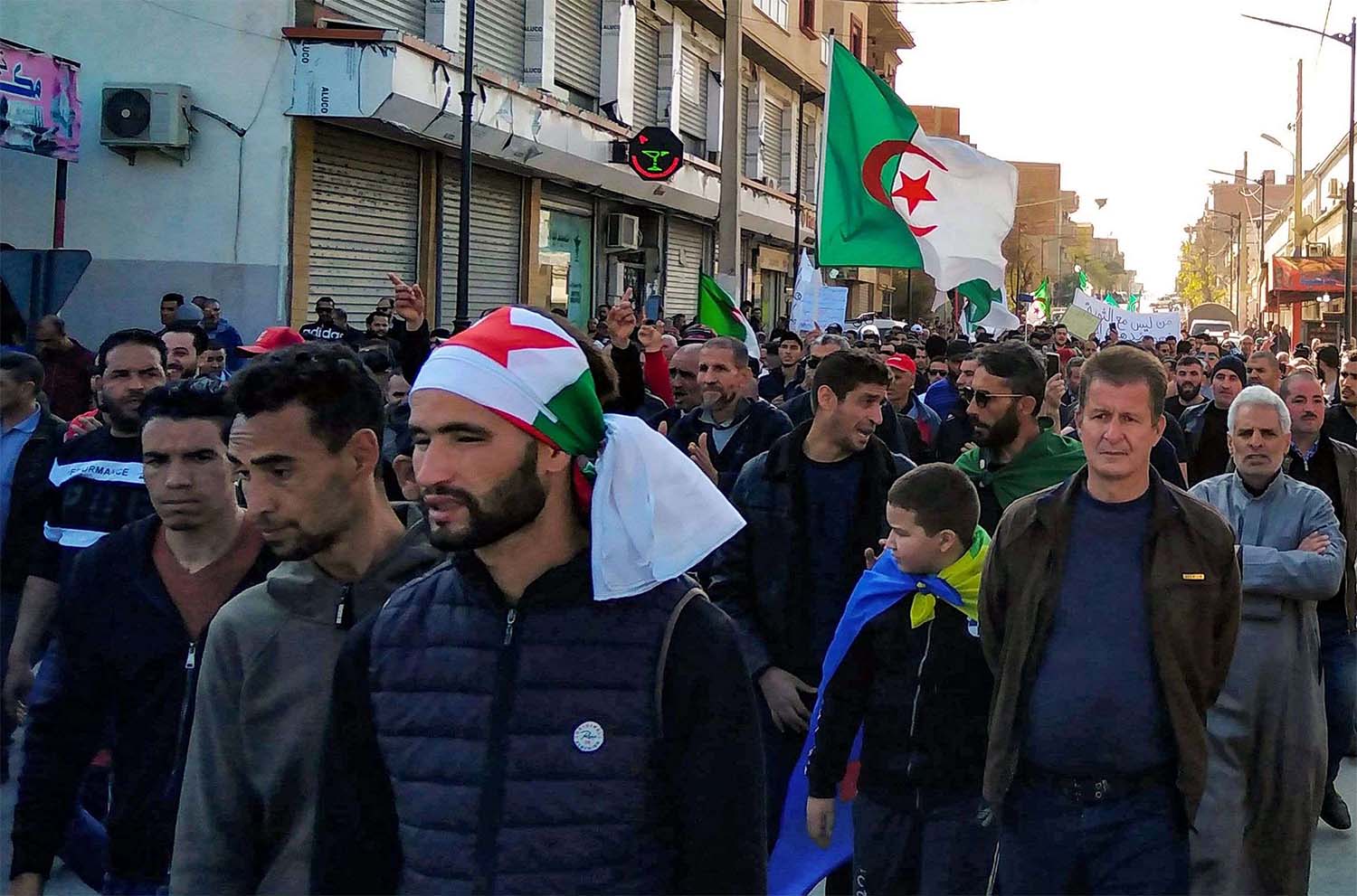 Algerians march in an anti-government demonstration in the Algerian city of Bordj Bou Arreridj on Feb. 14