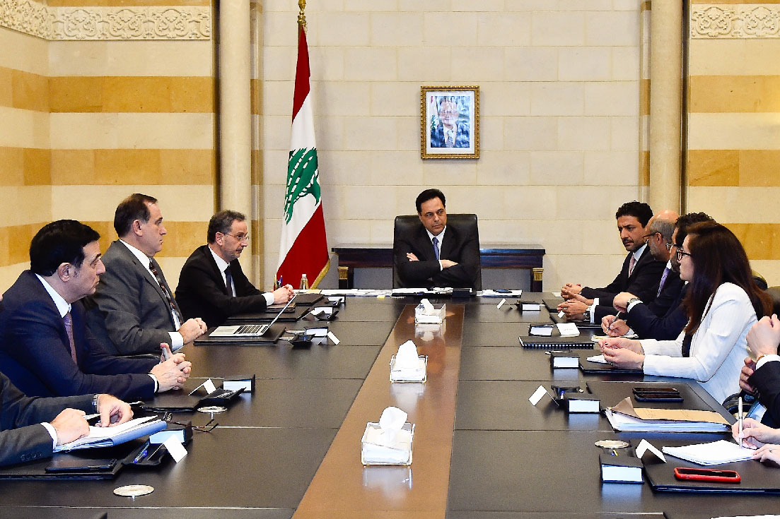 Lebanese Prime Minister Hassan Diab (C) meets a delegation from the International Monetary Fund (IMF) in Beirut