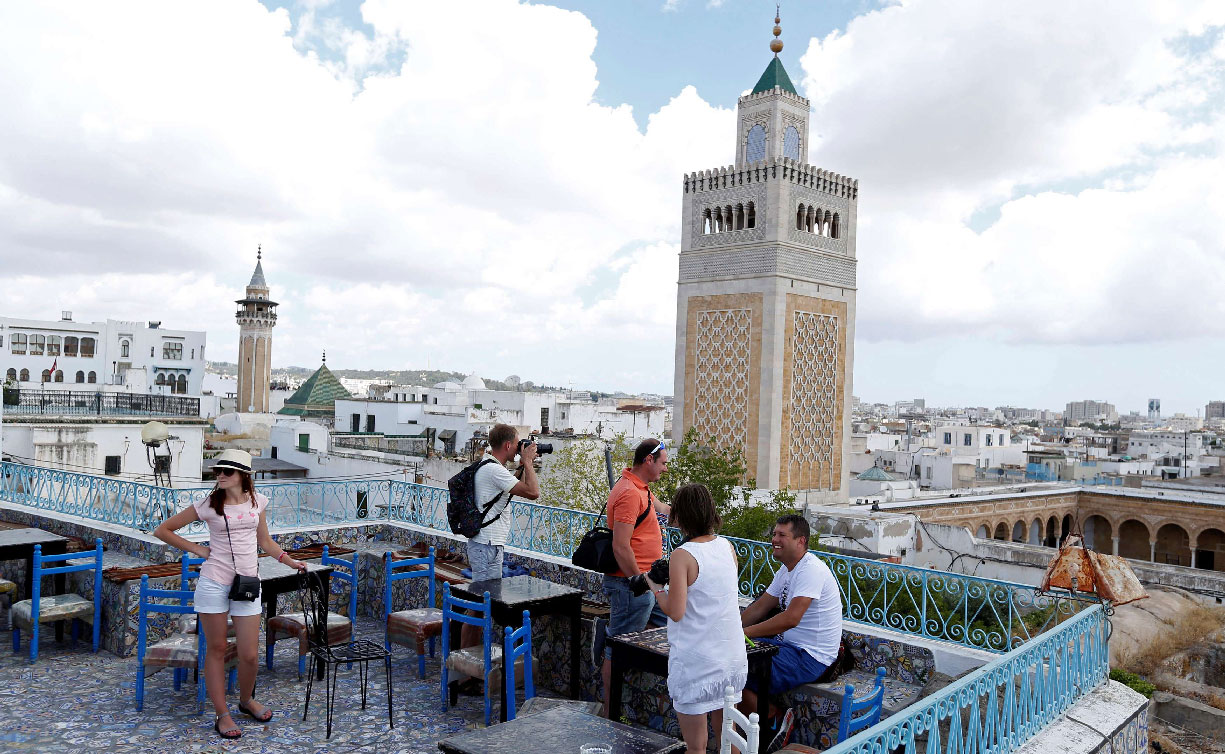 Russian tourists are seen on a terrace at the Medina of Tunis