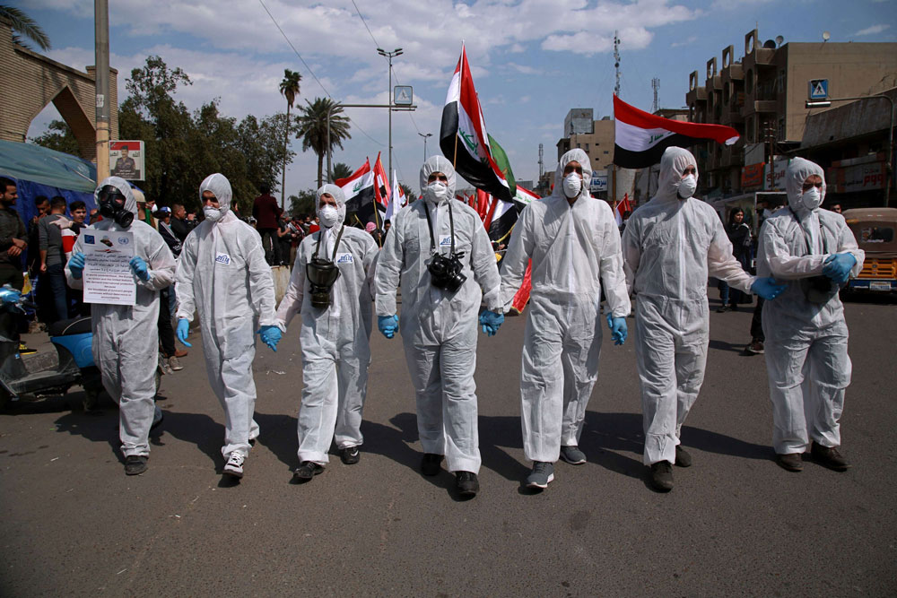المحتجون العراقيون يتكيفون مع فيروس كورونا
