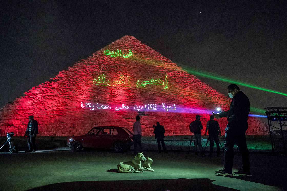 Laser projection on the Great Pyramid writes "Stay at home, stay safe."