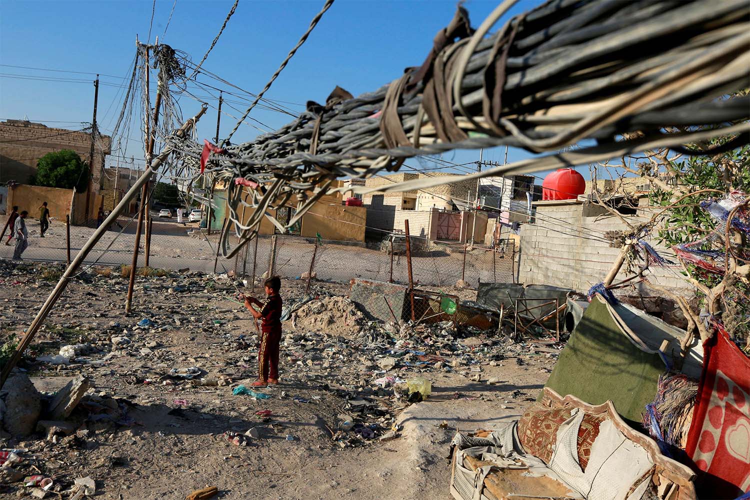 A view of the wire chaos of generator distribution of electricity in Najaf