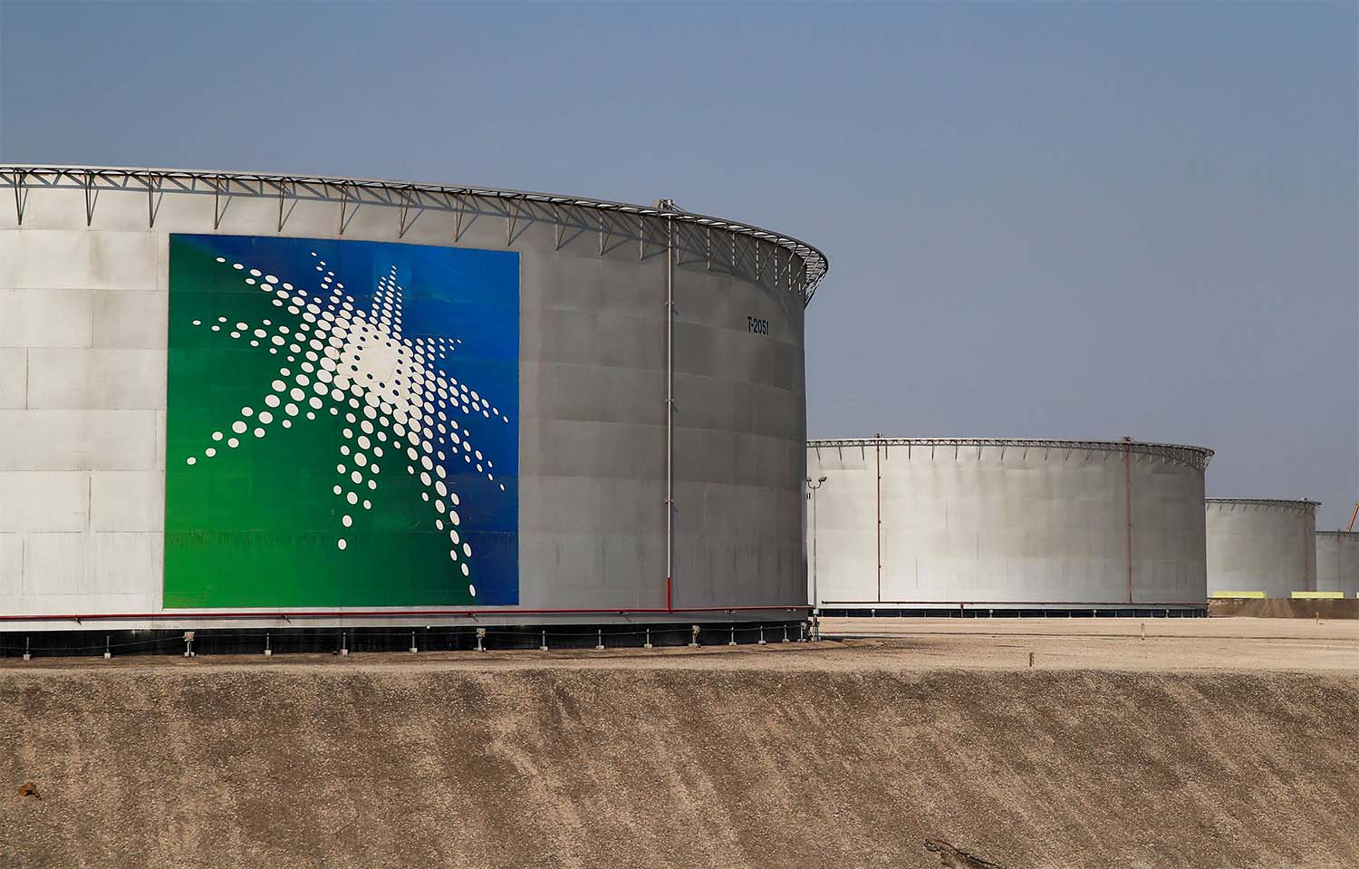 Branded oil tanks at Saudi Aramco oil facility in Abqaiq, Saudi Arabia 