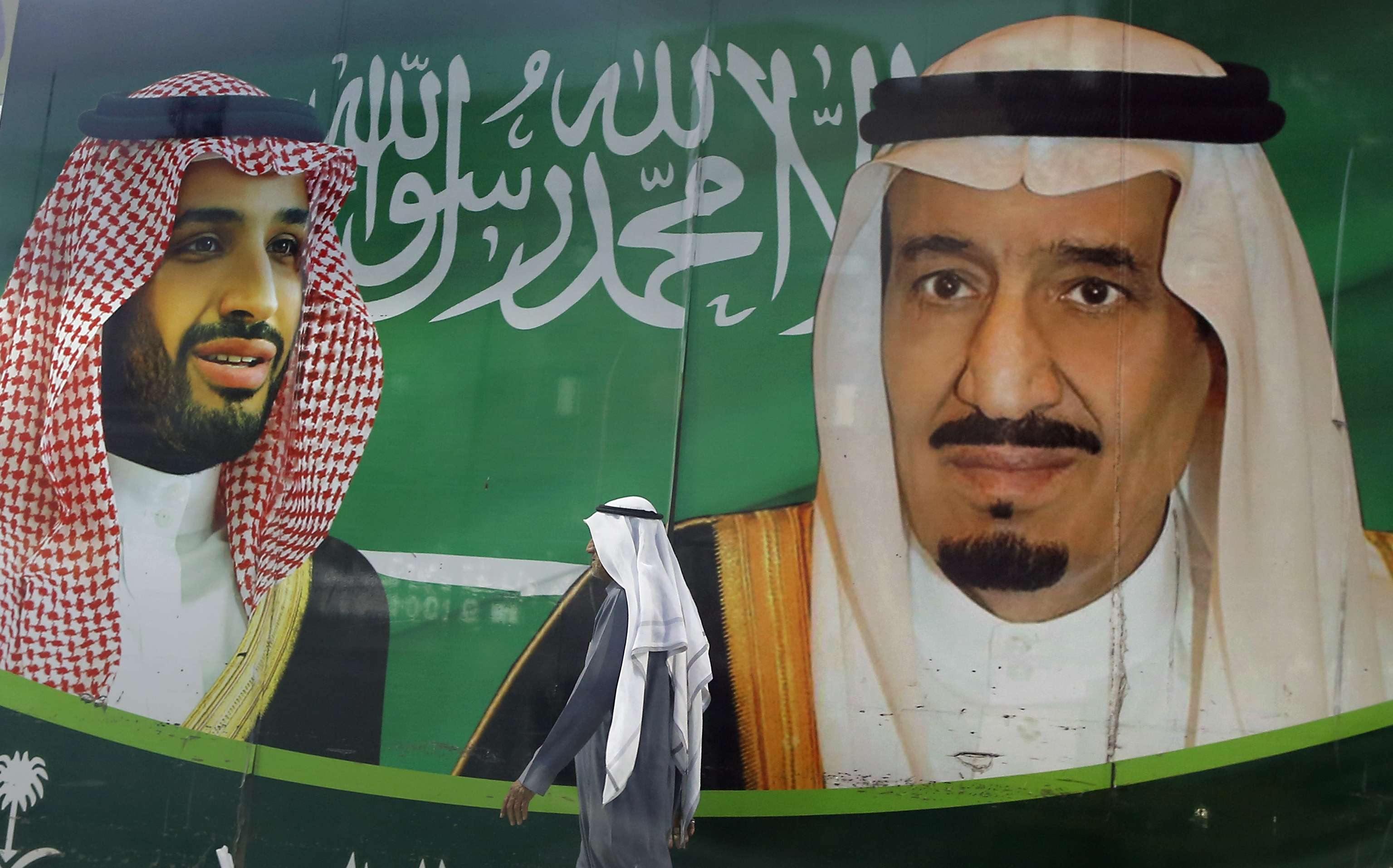 Banner showing Saudi King Salman (R)  and his Crown Prince Mohammed bin Salman