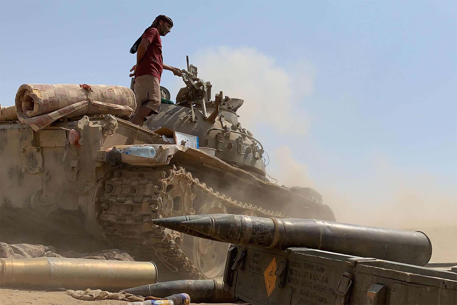 A fighter loyal to Yemen's separatist Southern Transitional Council (STC) stands atop a tank