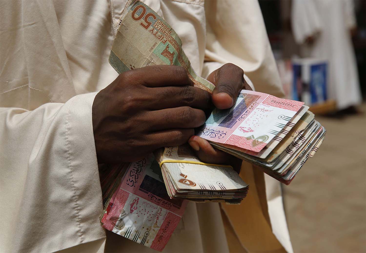 Sudanese pound's official rate is 55 to the US dollar, compared to 140 on the black market