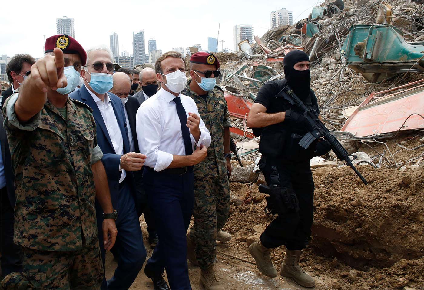 French President Emmanuel Macron visits the devastated site of the explosion at the port of Beirut