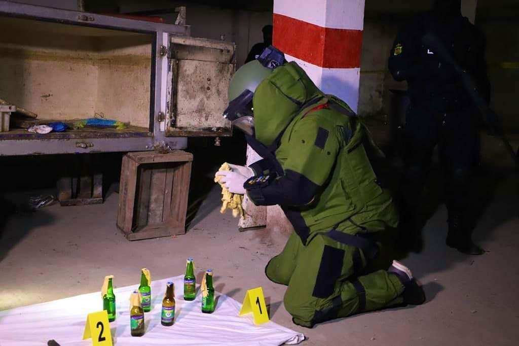 Explosives technician handling the seized substances