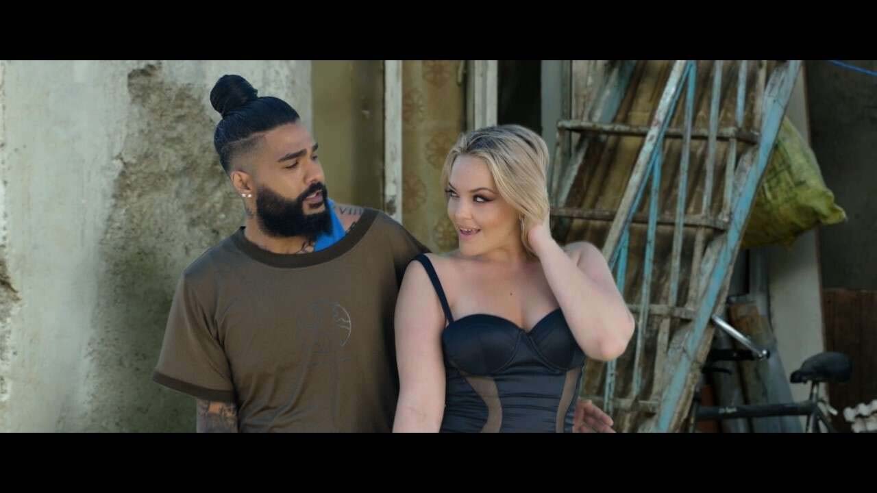 Sasy's video features actresses, including an American porn star, gyrating in kimonos and short bodycon dresses atop cars and inside bars