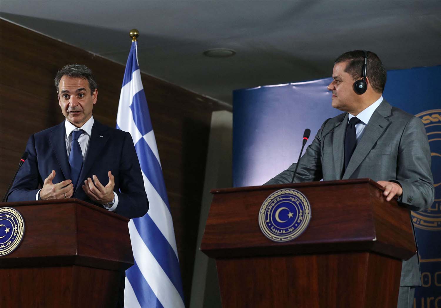 Libya's interim prime minister Abdul Hamid Dbeibah (R) and Greece's Prime Minister Kyriakos Mitsotakis (L)
