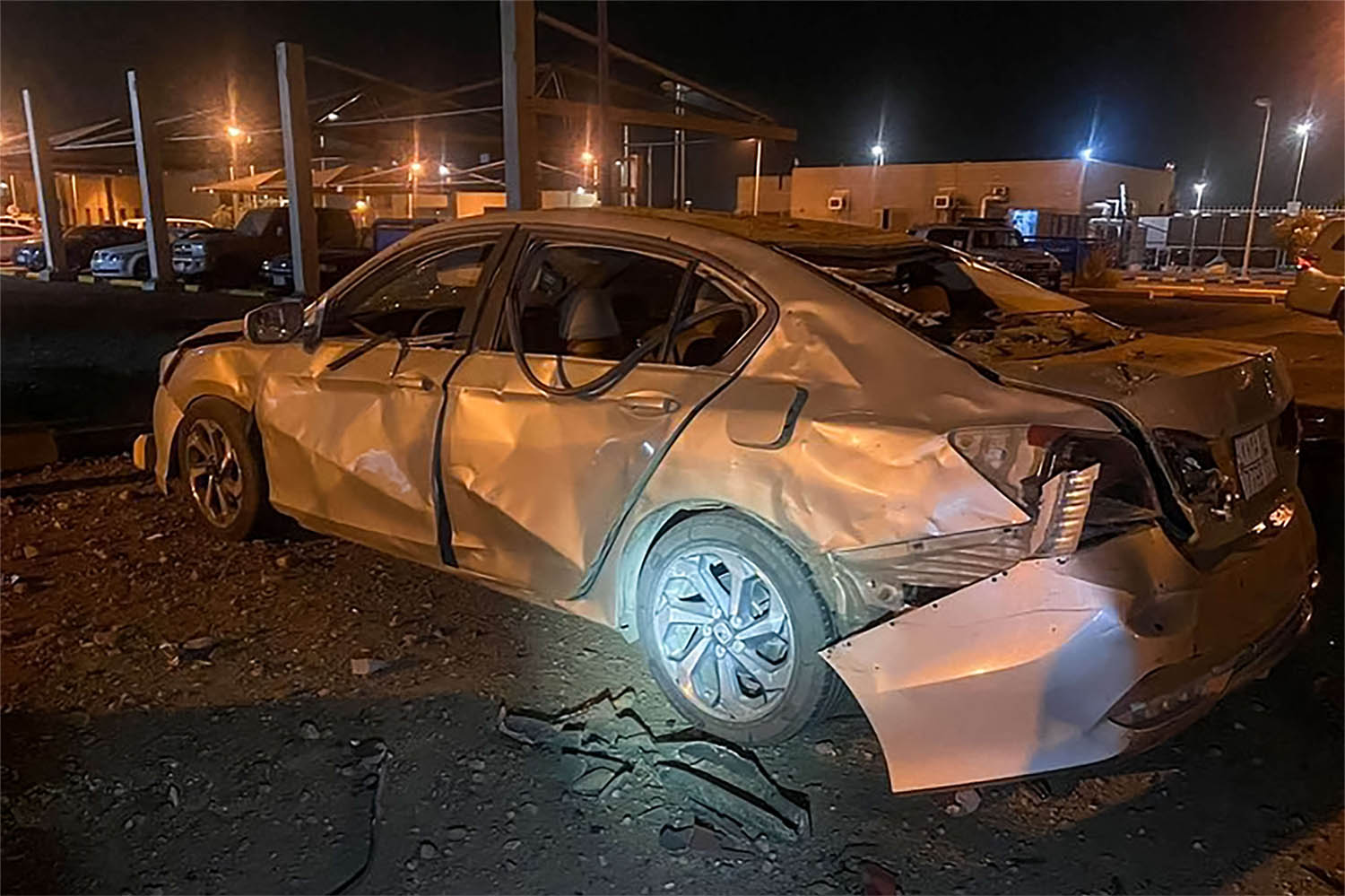 A car damaged by Houthi's drone attack at an Aramco oil terminal in the southern Saudi border town of Jizan o
