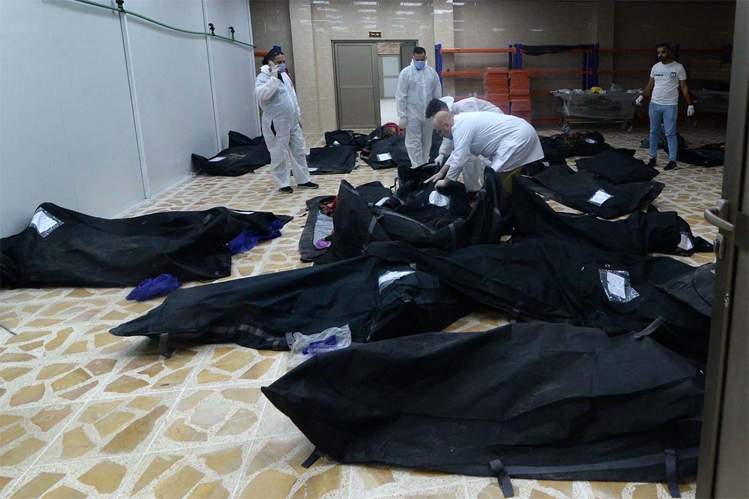 Bodies of people killed in a fire during a wedding in an event hall in Qaraqosh