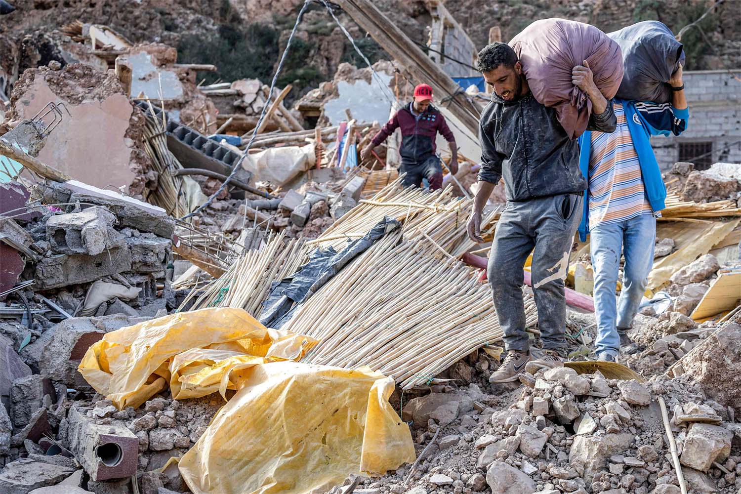 People conduct salvage operations in the aftermath of the deadly  earthquake