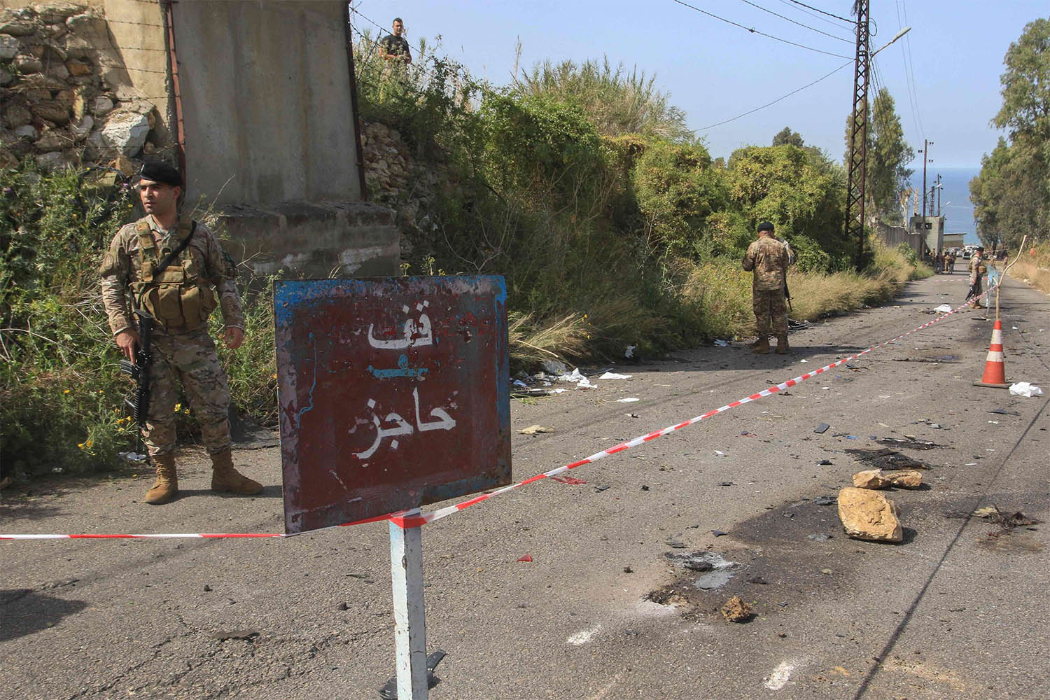 Lebanese security forces set up a checkpoint on the road leading to the scene of an Israeli airstrike in Baawert on April 22