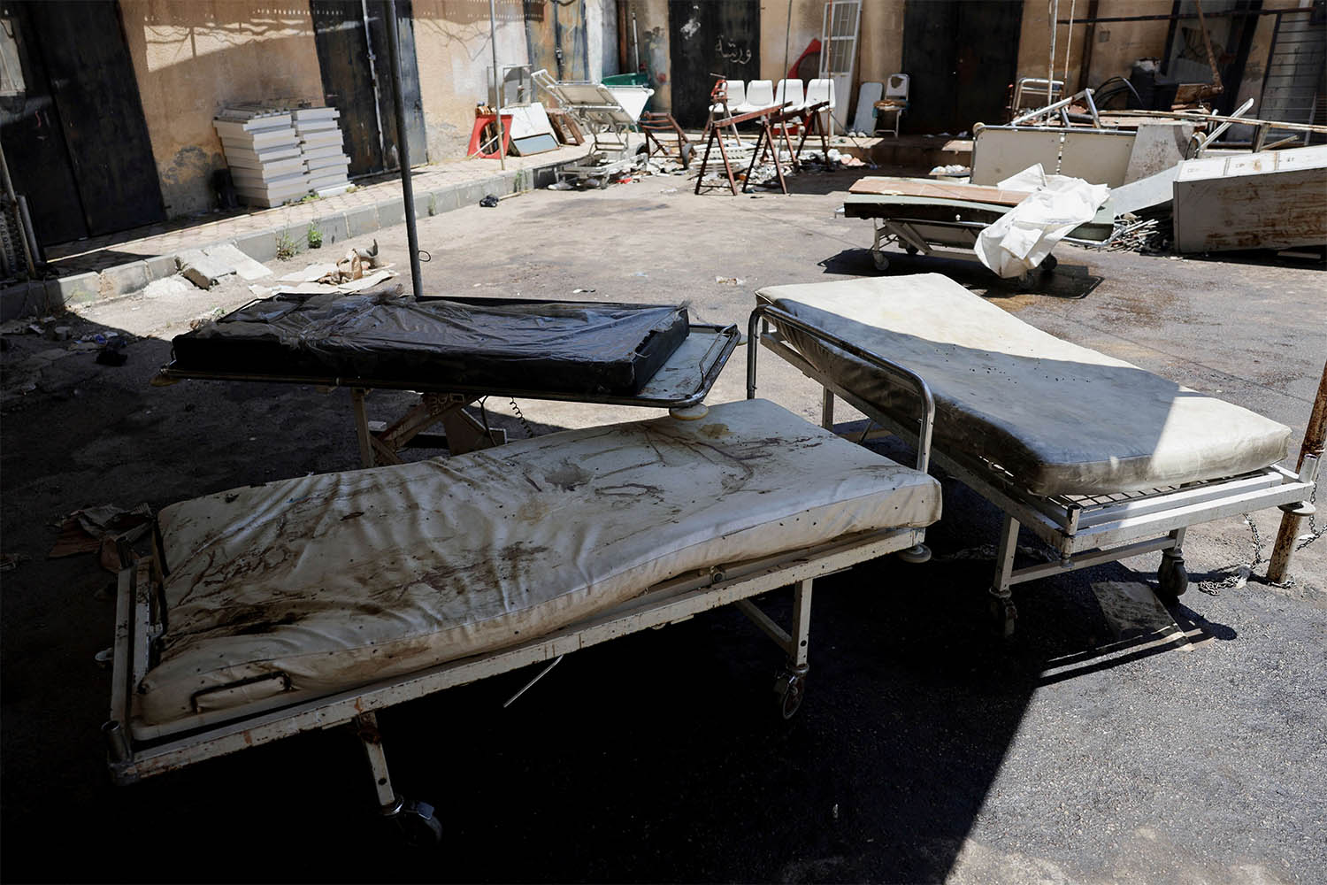 Stretchers stand outside a hospital in Sweida